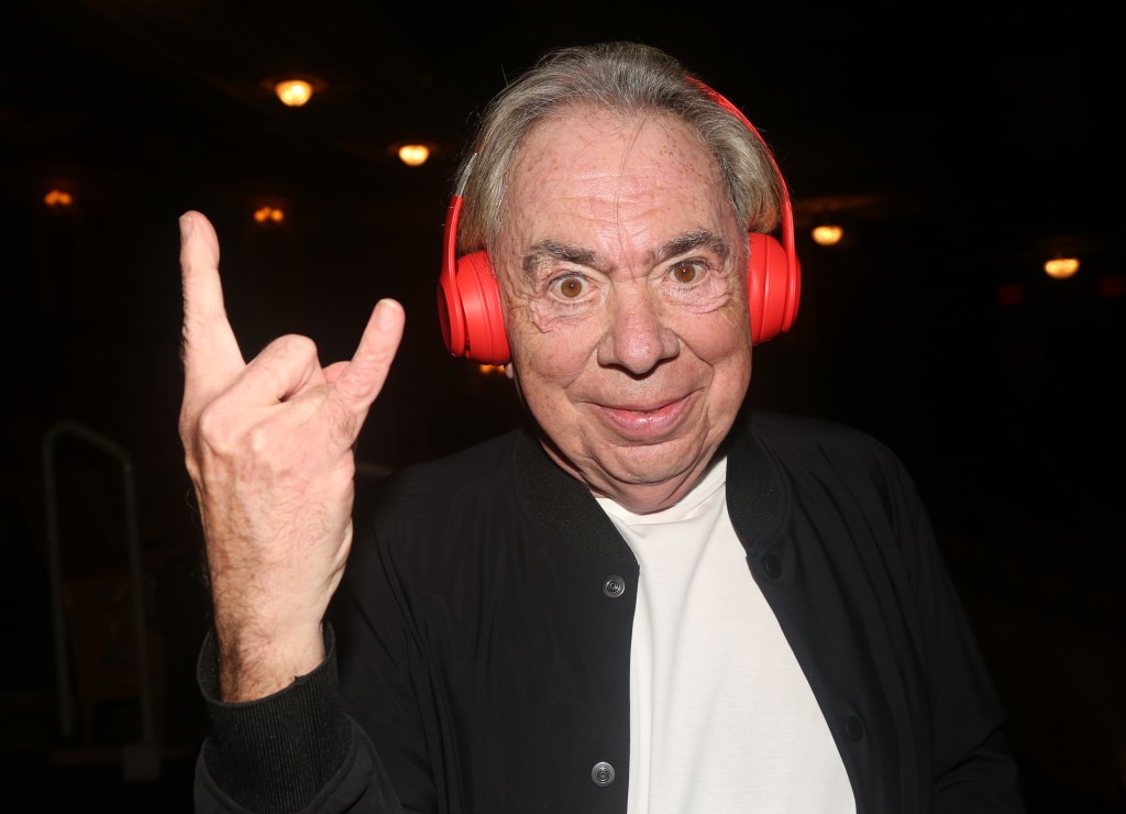 Andrew Lloyd Webber wearing red headphones