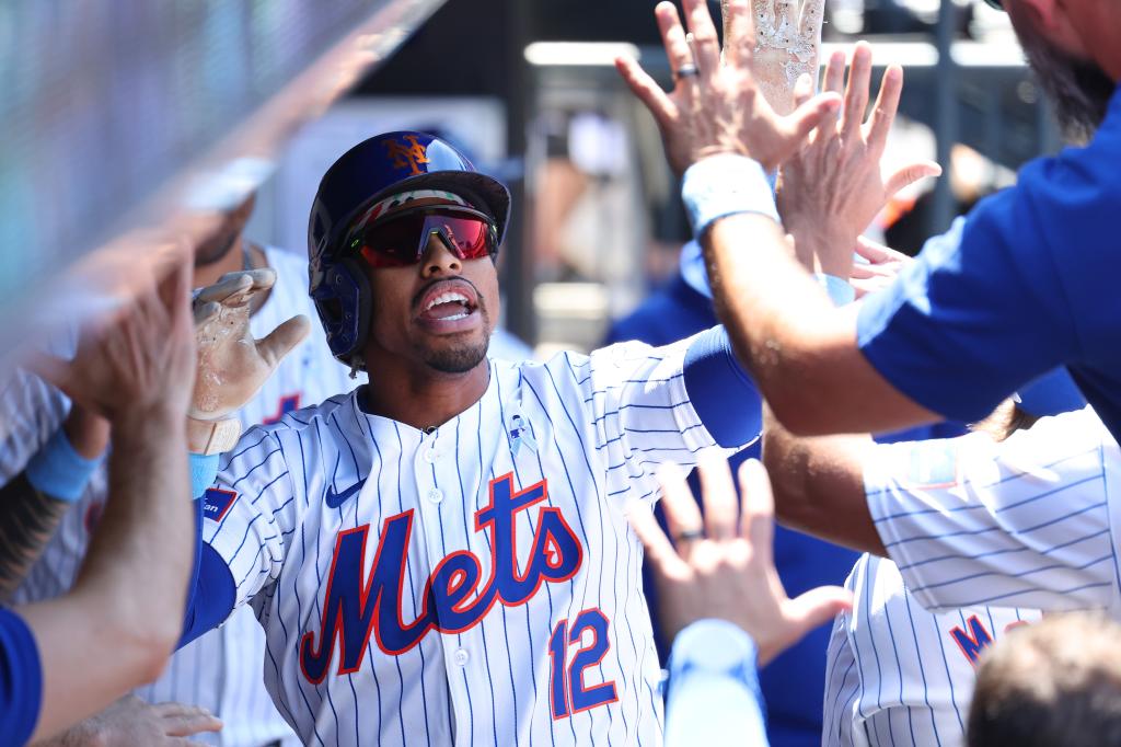 New York Mets shortstop Francisco Lindor hitting a solo home run during the first inning against the San Diego Padres at Citi Field