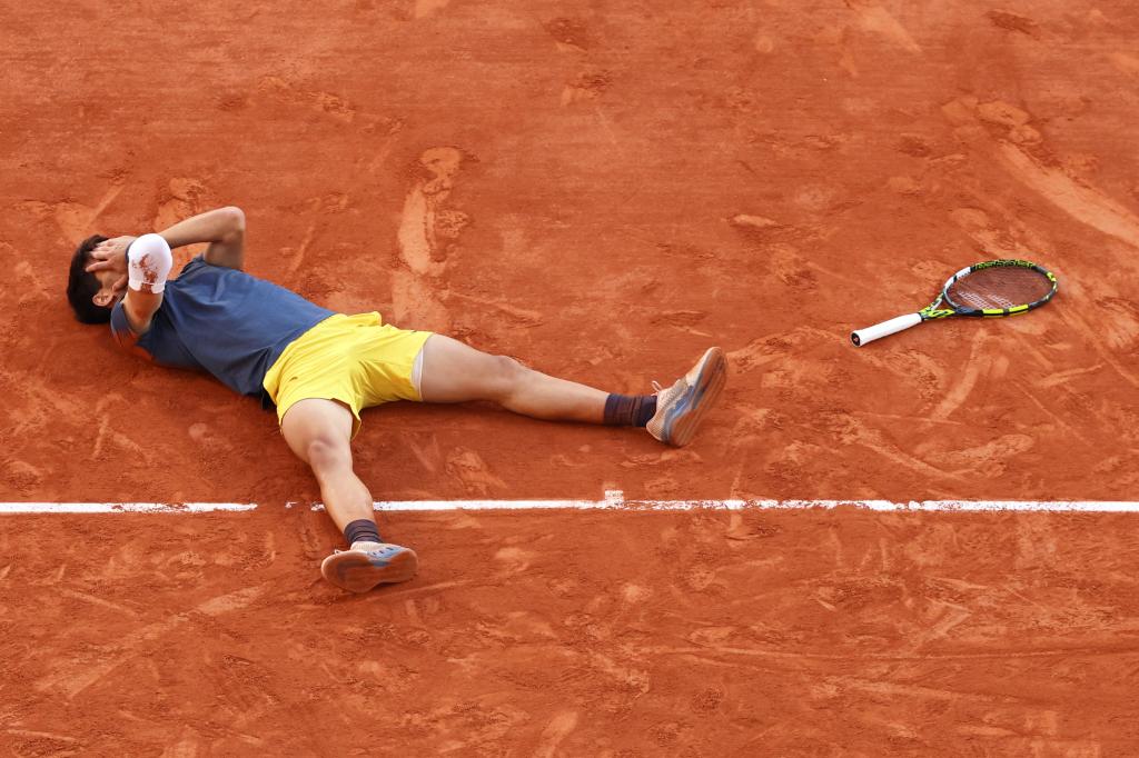 Carlos Alcaraz reacts after winning the 2024 French Open on Sunday.