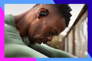 A man with a Bluetooth earpiece.