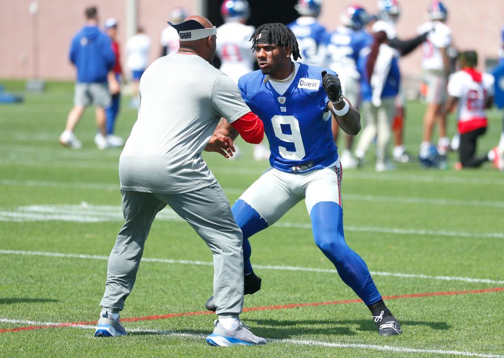 Steve Smith coaching New York Giants wide receiver Malik Nabers during an OTA session on May 30, 2024, in East Rutherford, New Jersey.