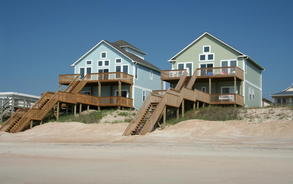 A row of colorful ocean front beach houses.