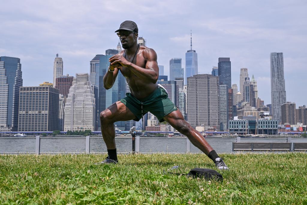 A man works out at the Brooklyn Bridge Park waterfront. 