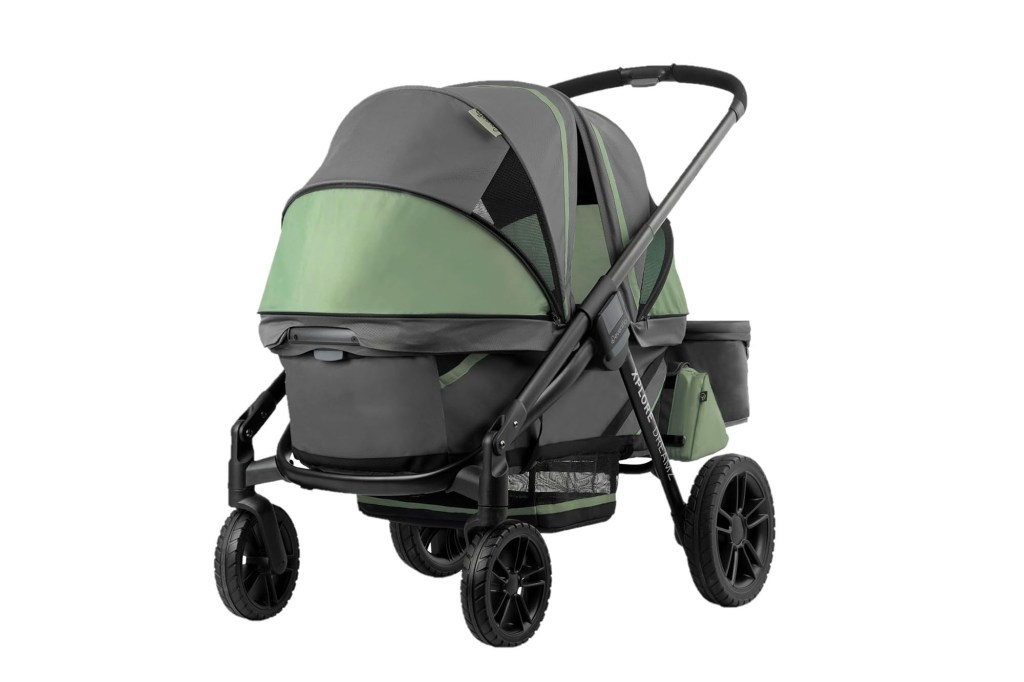 A stroller with a green and black cover