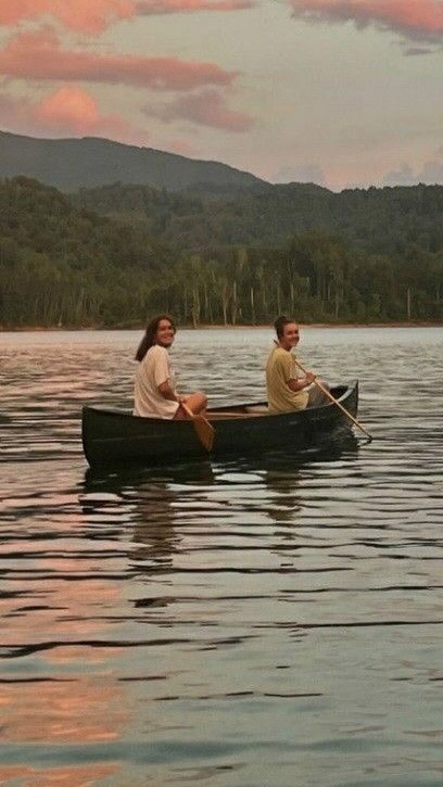 Women paddling on the lake at Camp Social 