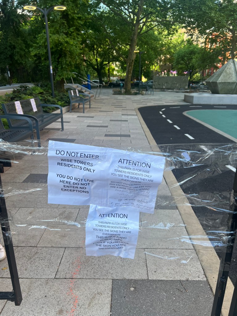 Handmade paper sign taped to a fence, attempting to prevent non-residents from using the Wise Tower playground