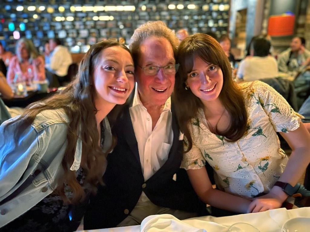 Sterling with his daughters, Veronica (left) and Abigail (right).