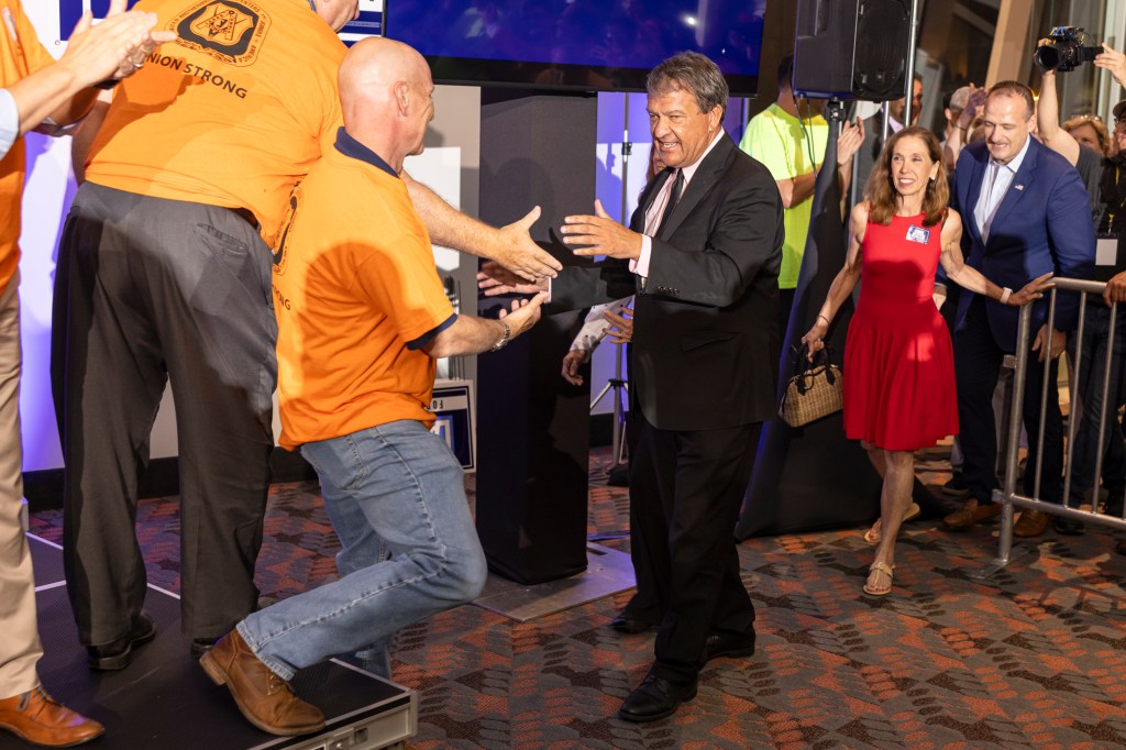 Latimer celebrating his victory with supporters at a watch party in Westchester.