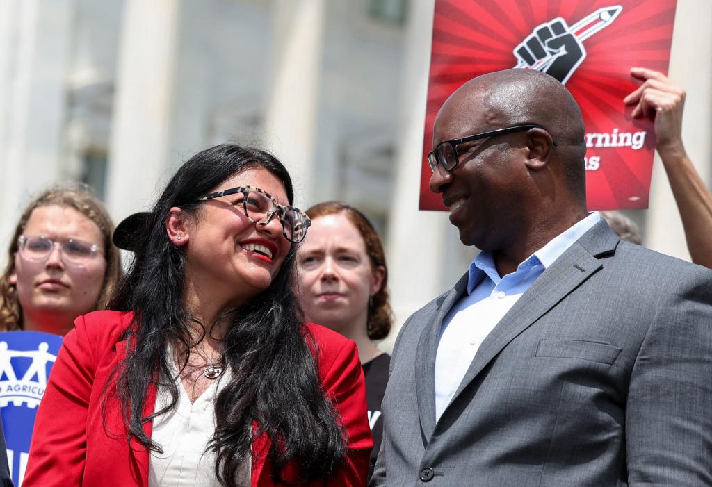 Bronx Rep. Jamaal Bowman and fellow anti-Zionist Rashida Tlaib smile at one another