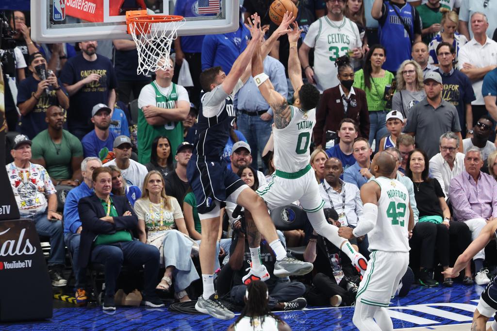 Jayson Tatum attempts to score during the Celtics' loss to the Mavericks on Friday.