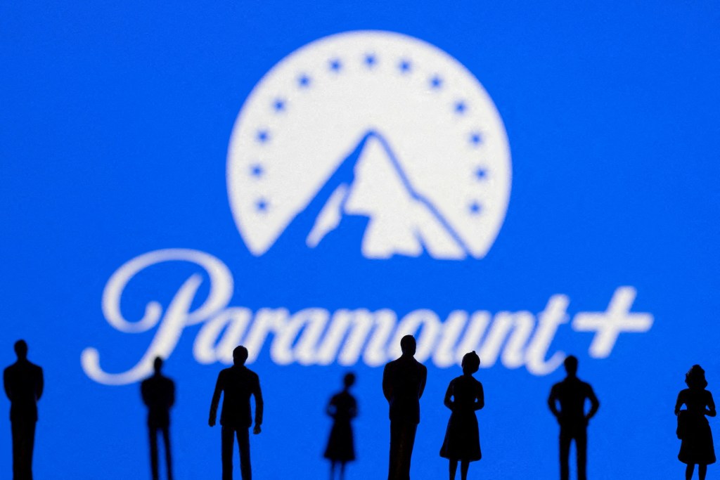 Silhouettes of people in front of the Paramount logo.