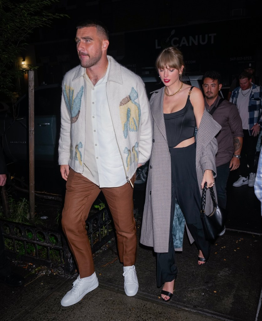 Travis Kelce holds hands with Taylor Swift during a date night in New York in October 2023.