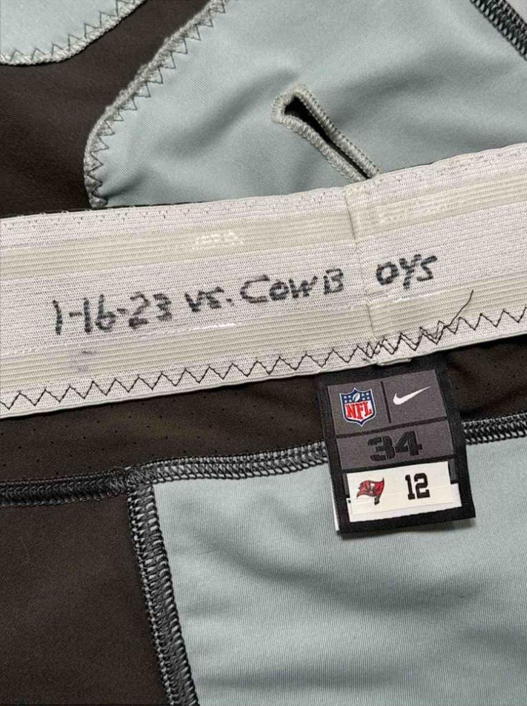 Tom Brady's uniform pants that he wore in his final NFL game with the Buccaneers were auctioned off for $89,100.