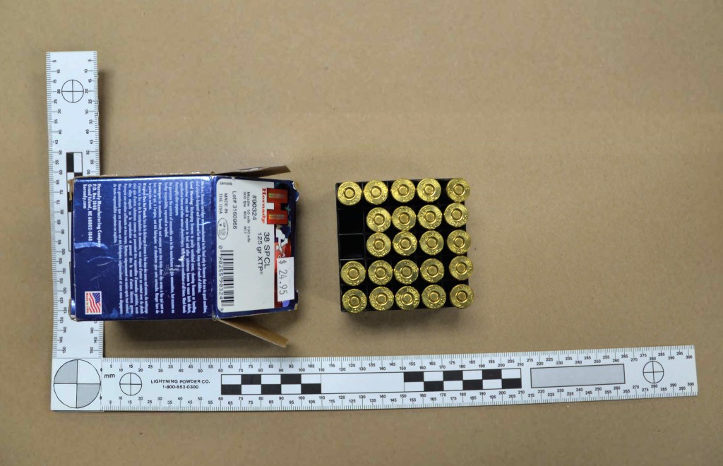 Twenty-five cartridges of Hornady American Gunner ammunition alongside a Colt Cobra 38SPL revolver set on a table, evidence from the Hunter Biden gun trial