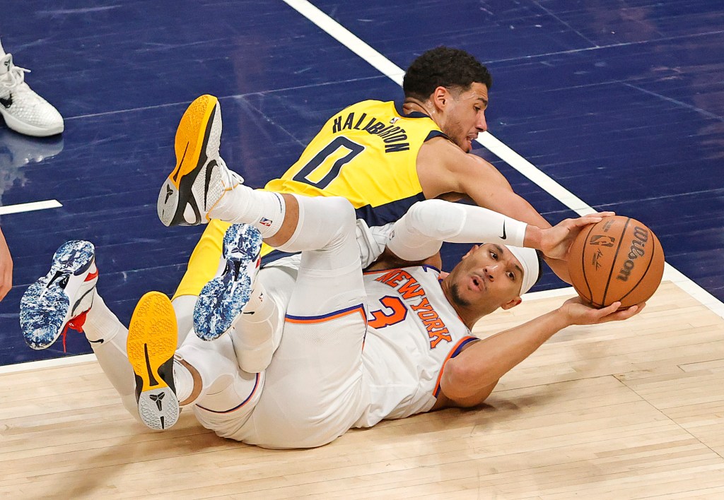 Tyrese Haliburton #0 of the Indiana Pacers and Josh Hart #3 of the New York Knicks fight for control of the ball during the first quarter.