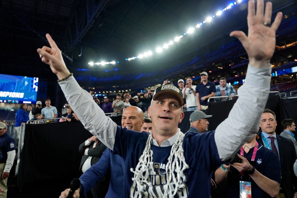 UConn head coach Dan Hurley greets fans after their win against Purdue in the NCAA college Final Four championship basketball game, Monday, April 8, 2024, in Glendale, Ariz. 