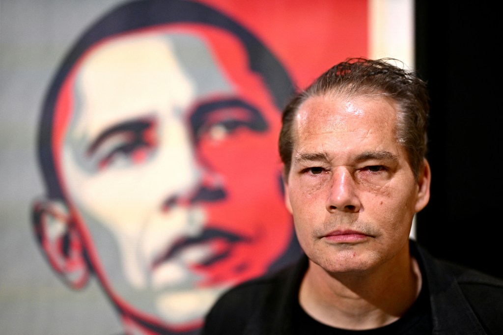 Shepard Fairey in front of his famous Hope image.
