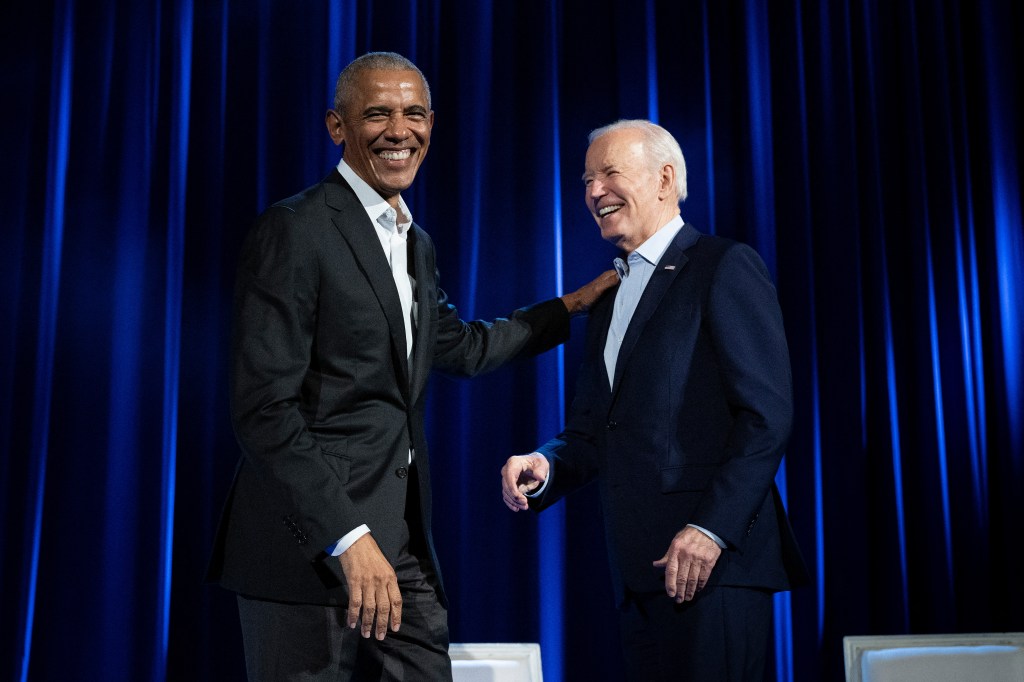 Former US President Barack Obama (L) and US President Joe Biden arrive for a campaign fundraising event at Radio City Music Hall in New York City on March 28, 2024.