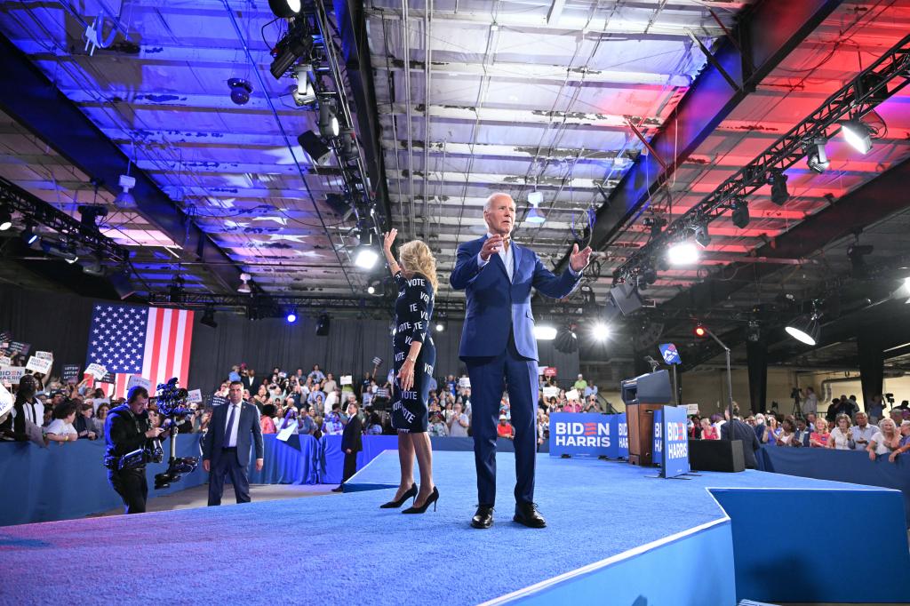 US President Joe Biden and First Lady Jill Biden wave 