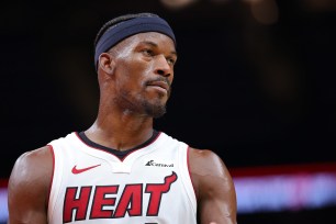 Jimmy Butler #22 of the Miami Heat reacts against the Atlanta Hawks during double overtime at State Farm Arena on April 09, 2024 in Atlanta, Georgia.