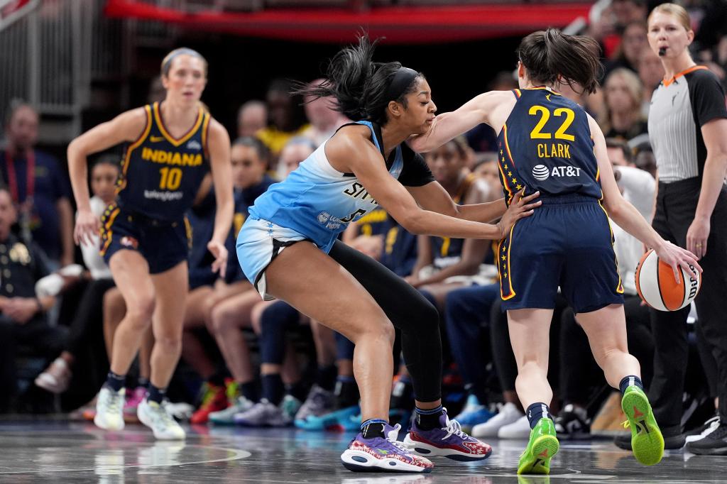 Angel Reese #5 of the Chicago Sky fouls Caitlin Clark #22 of the Indiana Fever during the second half at Gainbridge Fieldhouse on June 16, 2024 in Indianapolis, Indiana.