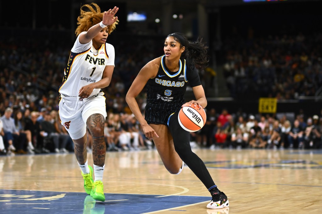 Angel Reese #5 of the Chicago Sky drives with the basketball in the first half against NaLyssa Smith #1 of the Indiana Fever at Wintrust Arena on June 23, 2024 in Chicago, Illinois. 