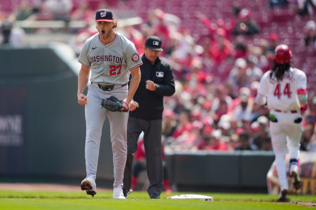 Jake Irvin yells after a double play against the Cincinnati Reds.