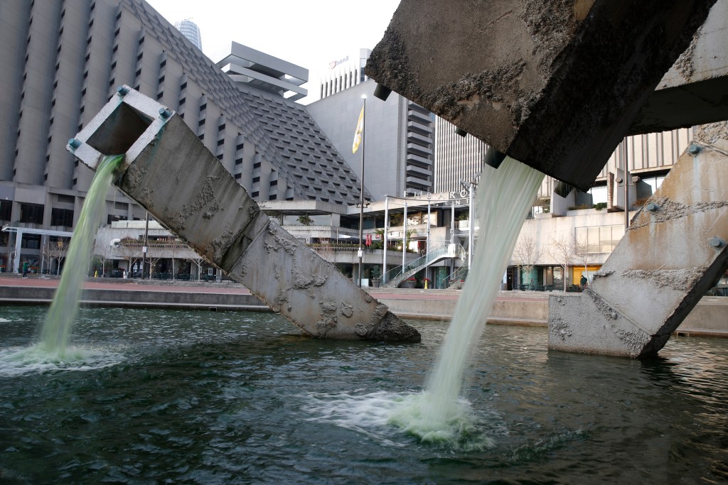 Water pours out of the Vaillancourt Fountain at Embarcadero Plaza in San Francisco, California.