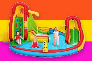 A group of kids playing on a water slide