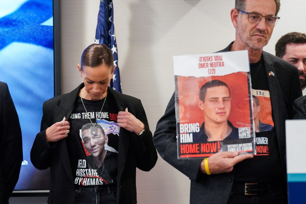 Yael Alexander wearing a t-shirt with an image of her son Edan Alexander's face, at a press conference in New York City regarding American hostages in Gaza.