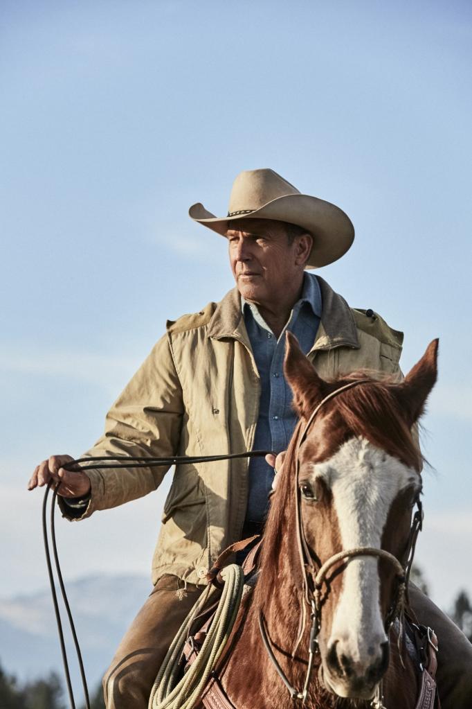 Kevin Costner, in cowboy hat, riding a horse in a promotional image for the show 'Yellowstone'