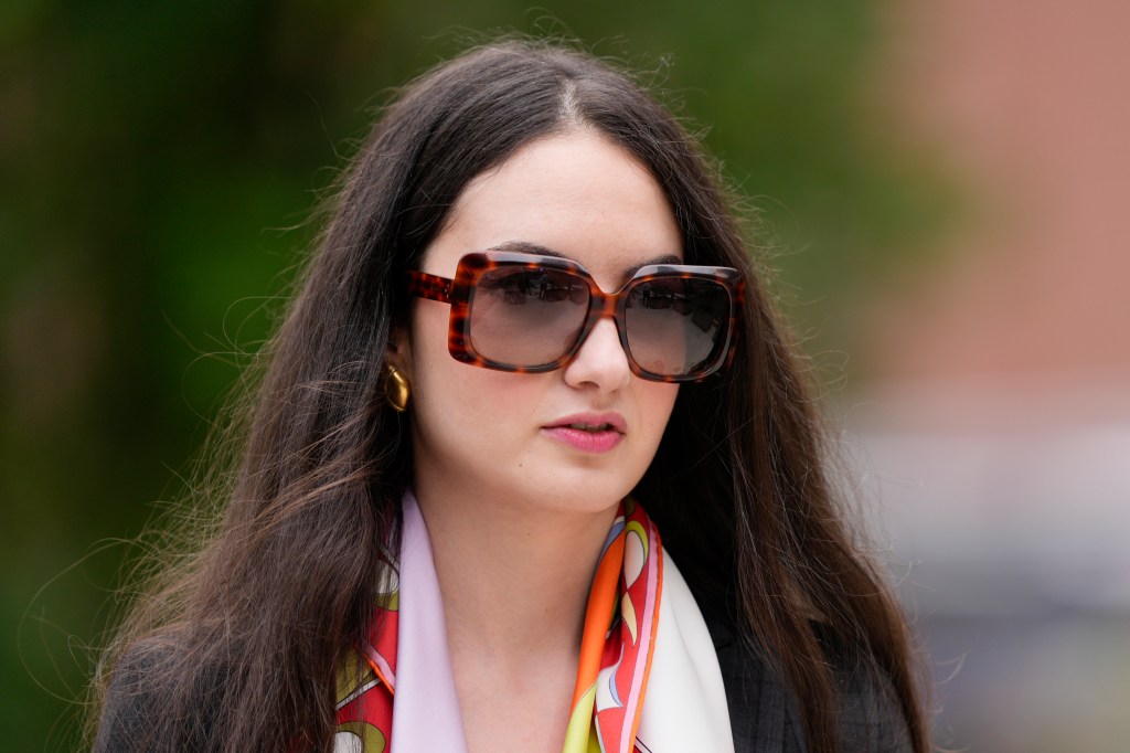 Zoe Kestan, a woman wearing sunglasses and a scarf, departing from federal court in Wilmington, Del. on June 5, 2024