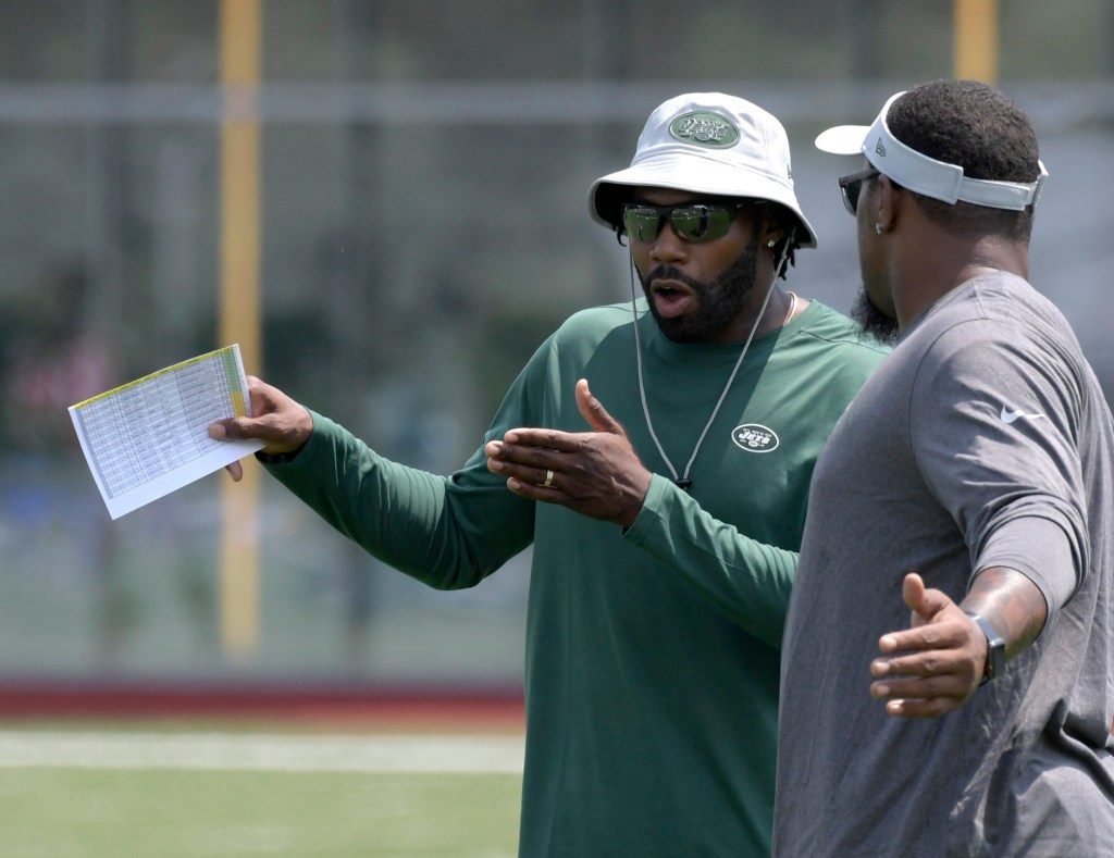 New York Jets assistant Antonio Cromartie, left, during practice at training camp.