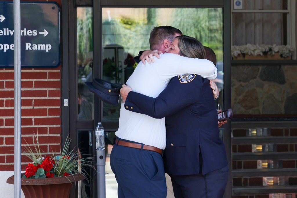 Mourners hugged tight while paying their respects. 