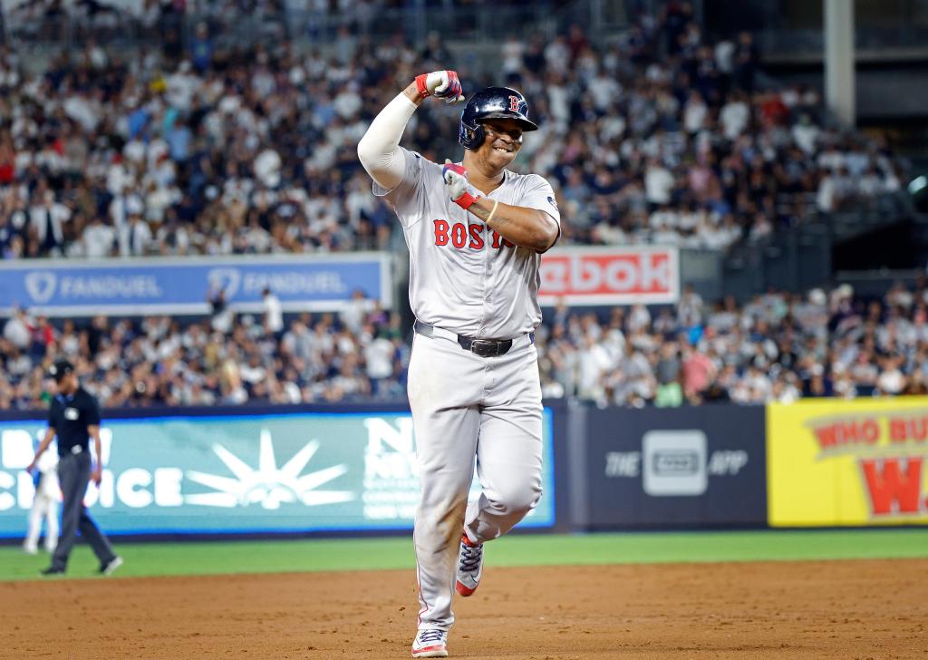 Boston Red Sox third baseman Rafael Devers #11reacts as he rounds the bases on his solo homer, his second of the game during the 9th inning. The Boston Red Sox defeat the New York Yankees 3-0.