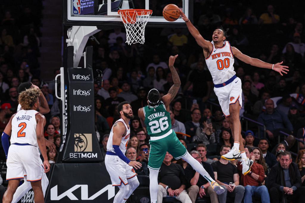 New York Knicks forward Jacob Toppin (00) blocks a shot by Boston Celtics guard DJ Steward (26) during the second half at Madison Square Garden.
