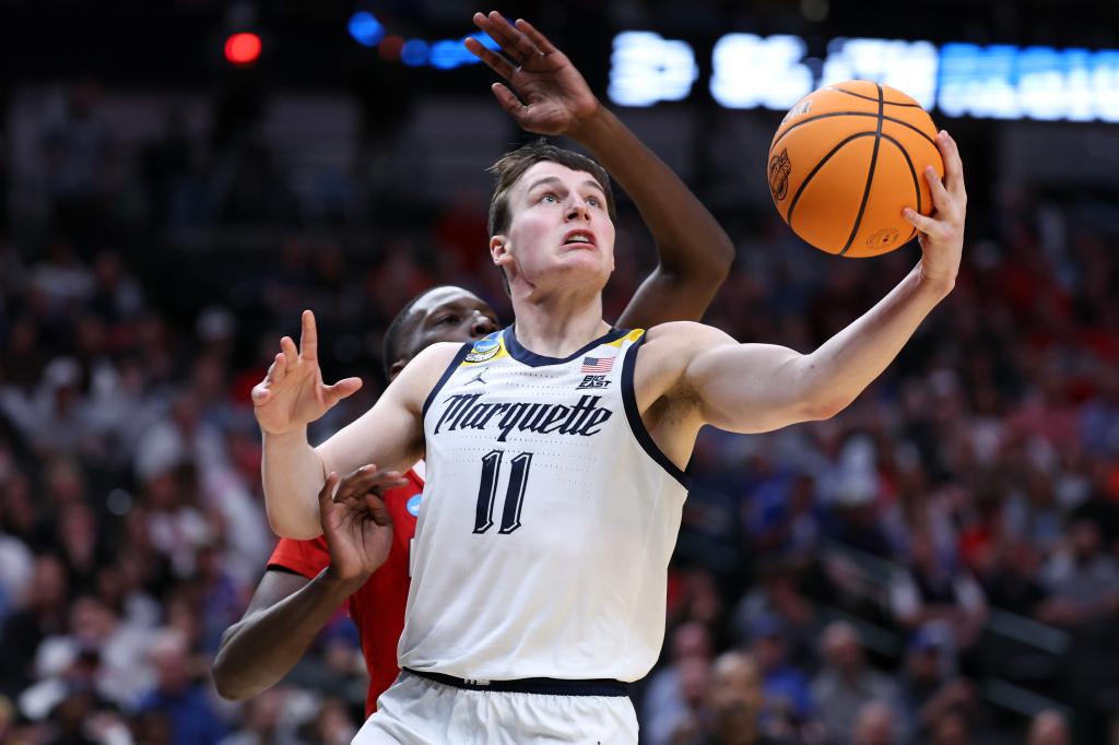 Tyler Kolek #11 of the Marquette Golden Eagles shoots the ball against the North Carolina State Wolfpack during the second half in the Sweet 16 round of the NCAA Men's Basketball Tournament at American Airlines Center on March 29, 2024 in Dallas, Texas. 