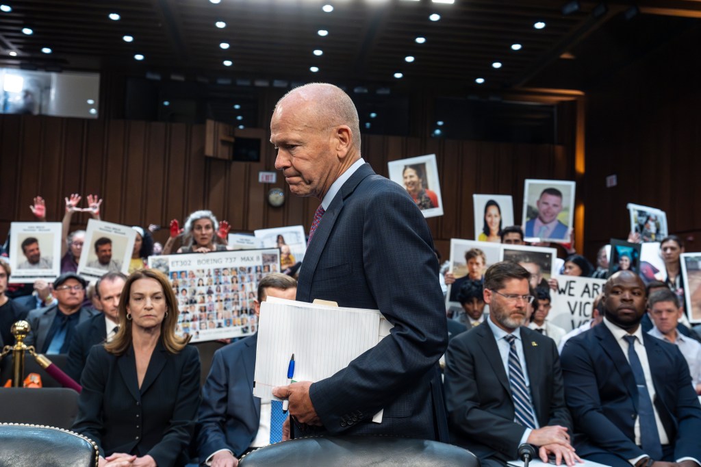 Families holding posters of loved ones killed, including in the crash of Lion Air Flight 610 off Indonesia in 2018 and Ethiopian Airlines Flight 302 near Addis Ababa in 2019, were behind Calhoun during his June testimony. 