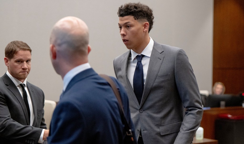 Jackson Mahomes, right, leaves the courtroom following a bond motion hearing in Johnson County District Court, May 16, 2023, in Olathe, Kan. 