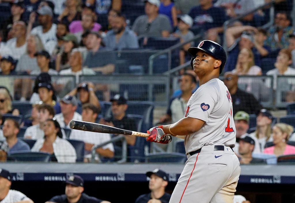 Rafael Devers watches his home run off Luis Gil during the seventh inning on Sunday night in The Bronx.