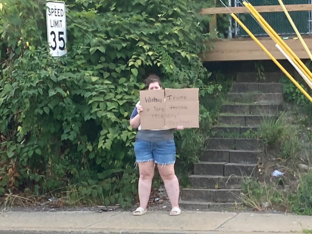 A protester near the hospital where Trump was treated following the shooting.