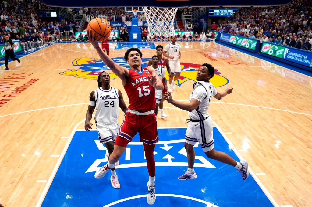 Kansas guard Kevin McCullar Jr. (15) puts up a shot during the first half of an NCAA college basketball game against Kansas State Tuesday, March 5, 2024, in Lawrence, Kan. 