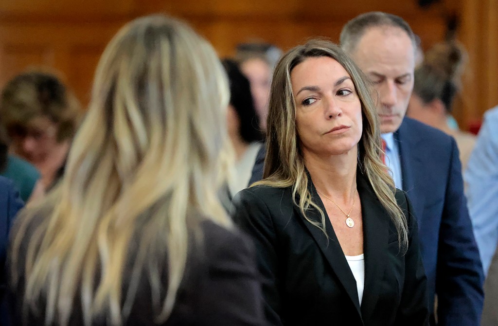 All stand as the jury files out to the courtroom, to start their fifth day of deliberations in the murder trial for Karen Read in Norfolk Superior Court in Dedham, Mass., Monday, July 1, 2024. 