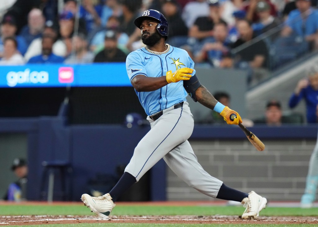 Tampa Bay Rays' Randy Arozarena (56) hits an RBI single against the Toronto Blue Jays during the sixth inning of a baseball game in Toronto, Wednesday, July 24, 2024.