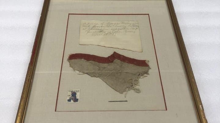 The fabric, which has darkened over the years, is currently on display at the Museum of the American Revolution.