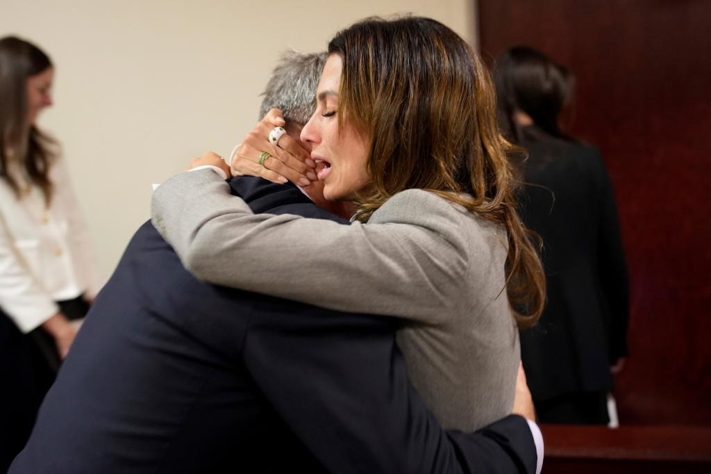 Baldwin's wife, Hilaria, embraces the actor in court.