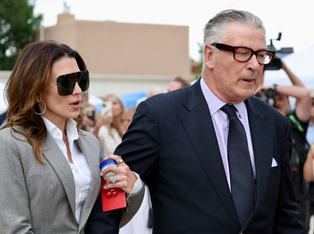 Alec Baldwin and wife Hilaria leaving court in suits after dismissal of charges