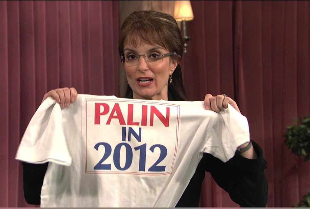 TIna Fey holding a Palin in 2012 shirt