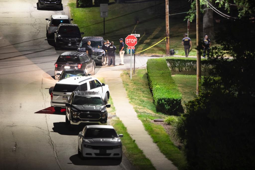 Authorities at the street entrance of suspect Thomas Crooks' home in Bethel Park, PA early Sunday morning.