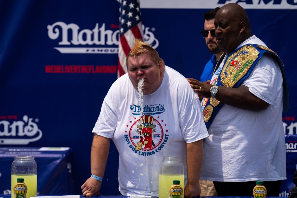 A participant throws up after competing in a Lemonade drinking contest at Nathan's Annual Hot Dog Eating Contest on July 4, 2024 in New York City.